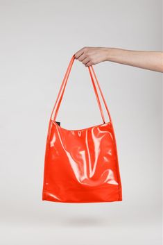 Shop for Orange high shine PVC tote bag at Glassworks London. Free UK shipping for orders over £75. Buy Now Pay Later with Klarna. Modern Glossy Shoulder Bag, Chic Glossy Tote Shoulder Bag, Glossy Finish Rectangular Bag, Rectangular Bags With Glossy Finish For Everyday Use, Rectangular Glossy Finish Bag For Everyday Use, Glossy Finish Shopping Bags With Double Handle, Chic Glossy Finish Tote Shoulder Bag, Everyday Double Handle Bags With Glossy Finish, Everyday Double Handle Glossy Bags