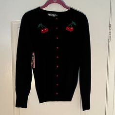 Black Button Down Cardigan Sweater With Cherry Embroidered Detail. New With Tags. Junior Sizing. 70% Viscose 30% Nylon Cherry Cardigan, Sweaters Black, Button Down Cardigan, Black Button, Colorful Sweaters, Black Sweaters, Cardigan Sweater, Sweater Cardigan, Sweaters & Cardigans