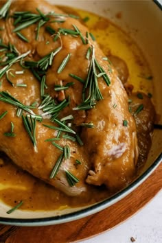 a close up of a plate of food with meat and gravy