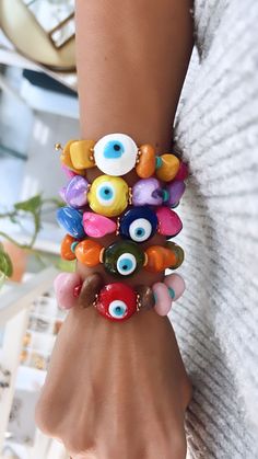 Trendy Multicolor Evil Eye Bracelet For Beach, Trendy Evil Eye Jewelry For Festivals, Multicolor Beaded Bracelet With Evil Eye, Trendy Multicolor Evil Eye Jewelry, Trendy Evil Eye Jewelry For Summer, Trendy Multicolor Evil Eye Bracelet For Friendship, Trendy Evil Eye Bracelet For Beach, Trendy Adjustable Multicolor Evil Eye Bracelet, Spiritual Multicolor Beaded Bracelets For Summer