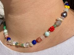 When you are a bit tired of minimalist and few colours - this abundant gemstone necklace is definitely for you!  It is made of different natural gemstones in high quality - malachite, rose and clear quartz, agate, moonstone, aventurine, sunstone, angelite and lapis lazuli - with pearls, gold coated beads arranged into a flower and different multicolour seed and tube beads.  It's playful original design is a real eye-catcher, but not over the top! All done by hand specially for you. <3 The beads sit on durable elastic nylon thread. If you have any questions about this item - get in touch! xx  |Intellectual Property Disclaimer: products, photos, copywriting and all the text descriptions are the result of my creative process and therefore are protected by the    Copyright Law. Any use of afor Minimalist Beaded Necklaces With Natural Stones For Healing, Minimalist Natural Stone Beaded Necklaces For Healing, Minimalist Crystal Necklace With Round Natural Stones, Multicolor Natural Stones Beaded Necklace For Everyday, Everyday Multicolor Beaded Necklaces With Natural Stones, Everyday Multicolor Natural Stone Beaded Necklaces, Colorful Gemstones, Quartz Rose, Tube Beads