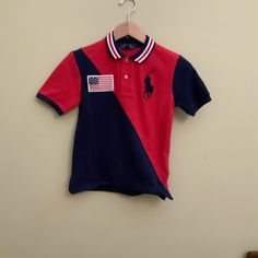 Shirt Fitted Flag Print Short Sleeve Tops, Blue Polo Collar Top For School, Blue Short Sleeve Polo Shirt For School, Blue Short Sleeve Shirt With Flag Print, Blue Flag Print Short Sleeve Shirt, Blue Cotton Tops With Flag Print, Red Cotton Shirt With Flag Print, Baby Polo, Hooded Long Sleeve Shirt