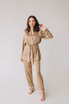 This women pajama is made of high-quality silk on a cotton base, making it pleasant to the touch and comfortable to wear in any season. The set includes classic loose-fitting pants with an elastic waistband and a button-up shirt that is lined with the same fabric. The pajama is decorated with trim and features a breast pocket on the shirt. The women's pajama comes with a belt, and the length of the pants, sleeves, and other measurements are customized for each client as the garment is tailored t Elegant Relaxed Fit Sleepwear For Loungewear, Elegant Relaxed Fit Sleepwear For Pajama Party, Chic Beige Sleepwear For Loungewear, Elegant Relax Fit Sleepwear For Pajama Party, Elegant Relaxed Fit Sleepwear Long Pants, Gloves Wedding Dress, Satin Pajamas Set, Maternity Long Dress, Loose Fitting Pants