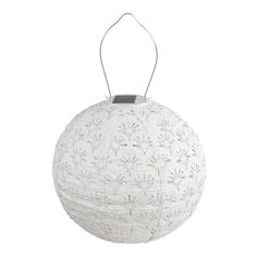 a white paper ball hanging from a string