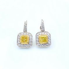 Fancy Yellow Diamond Earrings Style: Dangle Metal: 14 kt White & Yellow Gold Size: 19 MM Length = 10 MM Width Main Diamond: Radiant Diamonds ~1.40 tcw Color & Clarity: Fancy Yellow Accent Diamonds: 40 Round Brilliant Diamonds Hallmark: 14KT Includes: Certified Appraisal - Elegant Earring Box Sku#14650TOC081414FYVS1FGVS1-2.20TCWM1.40S0.80R14995 Return Policy: Returns accepted up to 14 days. Payment Information: We accept payment by PayPal International Buyers: Buyer is responsible for any customs fees or duties incurred by their country based on their country's rules & regulation no exceptions! We do not declare items of a lower value or mark any items as gift. Shipping: We ship via FED-EX Priority Overnight with Full Insurance & Adult Signature Required for delivery. Feedbacks: We strive t Yellow Diamond Earrings, Yellow Diamond Earring, Fancy Yellow Diamond, Earring Box, Halo Earrings, Radiant Diamond, Yellow Accents, White Earrings, Bezel Diamond