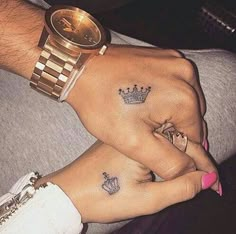 two people with matching tattoos on their hands