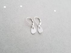 "These sterling silver earrings are a perfect match for any necklace, and are great for every day wear! An ultra shiny 7x10mm sterling silver teardrop hangs from sterling silver leverback or french earwires. The total length of these earrings is aprox 1\". These earrings will arrive in a small zip lock bag, as well as a decorative organza bag. It is recommended that the earrings are kept in the bag when not being worn to keep them nice and shiny. Of course, a quick polish will always work too :- Nickel Free Silver Teardrop Earrings For Everyday, Nickel-free Silver Teardrop Earrings For Everyday, Silver Nickel-free Teardrop Earrings For Everyday, Minimalist Nickel-free Silver Teardrop Earrings, Minimalist Silver Hypoallergenic Teardrop Earrings, Minimalist Hypoallergenic Silver Teardrop Earrings, Teardrop Earrings With Lever Back Ear Wires, Silver Teardrop Earrings With French Hook For Gift, Minimalist Teardrop Jewelry With Lever Back Ear Wires