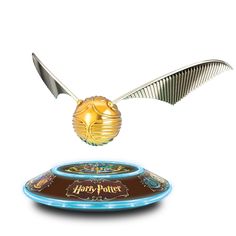 a harry potter flying saucer with a golden egg on it's side and the words, harry potter above it