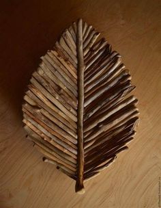 a piece of wood that is shaped like a leaf