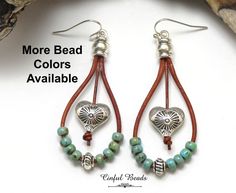 Add a touch of bohemian flair to your outfit with these unique boho leather dangle heart earrings. Each earring features a leather cord strung with beautiful Picasso seed beads in your choice of colors, encompassing a southwestern style heart bead that dangles elegantly in the center of a teardrop shape. These earrings are not only stylish but also versatile, as you can choose your preferred seed bead colors and earwires to customize them to your liking. Perfect for adding a pop of color and per Bohemian Beaded Earrings With Heart Beads For Gift, Bohemian Heart Beads Drop Earrings, Bohemian Heart Beads Earrings For Festival, Bohemian Earrings With Heart Beads For Festivals, Bohemian Beaded Heart Drop Earrings, Bohemian Festival Earrings With Heart Beads, Bohemian Heart-shaped Earrings With Dangling Beads, Nickel-free Dangle Heart Earrings For Festivals, Bohemian Heart Bead Dangle Earrings