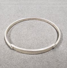 -PRODUCT TYPE - 925 Sterling Silver Bangle -MATERIAL - Silver -PURITY - 925 -TOTAL WEIGHT - 15.830 GRAMS - BANGLE WIDTH - 4 MM - BANGLE INSIDE DIAMETER - 61 MM We are proud to launch this dainty and minimalist thick bangle made with 925 silver on Etsy. This item is 100% handmade from start to finish. -Quality is guaranteed. Our mission is always to satisfy our customers with our offerings, so just relax and place order! -For Express shipping it is advised that if you order in bulk, you will get Classic Adjustable Hoop Bracelets, Adjustable Bangle With Sterling Silver Clasp, Silver Hoop Bracelets For Everyday, Adjustable Oval Sterling Silver Bracelets, Adjustable Oval Sterling Silver Bracelet, Modern Adjustable 925 Stamped Bracelets, Modern Adjustable Bracelet Stamped 925, Classic Adjustable Bracelet Stamped 925, Modern Adjustable 925 Stamped Bracelet