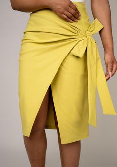 Meet the skirt that effortlessly transitions from day to night. Our versatile wrap skirt is designed for the modern woman who loves to mix and match her wardrobe. Whether you pair it with heels for a sophisticated look or with flats or sneakers for a casual vibe, this skirt is sure to become a staple in your collection. The endless styling possibilities make it a must-have piece for every fashion-forward woman. SIZE & FIT: High Waist: Flattering high waist design for a sleek silhouette. Side Det Chic Green Lined Wrap Skirt, Knee-length Wrap Skirt For Spring Workwear, Summer Wrap Skirt With Tie Waist For Work, Chic Knee-length Wrap Skirt For Day Out, Spring Workwear Wrap Skirt With Tie Waist, Spring Wrap Skirt With Tie Waist For Work, Summer Workwear Skirt With Tie Waist, Chic Green Spring Wrap Skirt, Chic Green Wrap Skirt For Spring