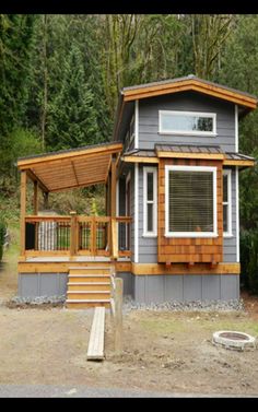 a small house in the middle of some trees