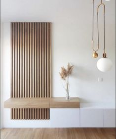 a white room with wooden paneling and two lights hanging from it's ceiling