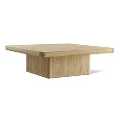 a square wooden table sitting on top of a white surface with no one around it