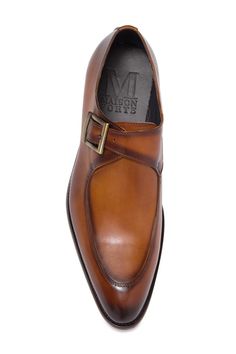 This leather constructed loafer features an almond toe and buckle strap.Sizing: True to size. M=standard width- Almond toe- Buckle strap vamp- Leather construction- Lightly padded insole- Topstitched detail- Stacked block heel- Welt stitching - Imported Leather upper, manmade sole Brown Monk Strap Shoes With Buckle Closure, Fall Monk Strap Shoes With Almond Toe Leather Sole, Brown Leather Monk Strap Shoes With Tang Buckle, Leather Monk Strap Shoes With Buckle Closure, Brown Formal Leather Shoes With Buckle Closure, Brown Dress Shoes With Buckle For Business, Brown Dress Shoes With Buckle Closure For Business, Brown Business Dress Shoes With Buckle Closure, Brown Almond Toe Loafers With Buckle Closure