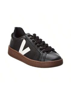 Introducing the VEJA Urca Sneaker, the must-have footwear for the environmentally conscious fashionista. Make a style statement while supporting a brand that's making a difference in the world. These black and white faux leather sneakers feature logo accents, a lace-up closure, and a lightly padded insole for all-day comfort. The rubber sole provides traction for any urban adventure. Imported and available in European sizes, be sure to reference the size chart for US conversions. Step out in sty Modern Fall Sneakers With Rubber Sole, Sporty Black Sneakers For Spring, Modern Black Sneakers For Spring, Fall Everyday Sneakers With White Sole, Logo Sneakers For Spring Streetwear, Spring Streetwear Sneakers With Logo, Everyday Fall Sneakers With Gum Sole, Fall Everyday Sneakers With Gum Sole, Modern Sneakers With Logo For Spring