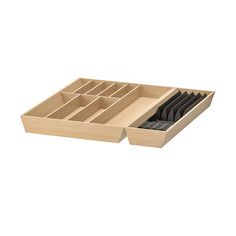 a wooden drawer with compartments and dividers