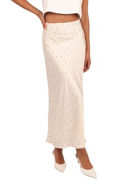 This flowy satin skirt is patterned in dainty blooms that bring fresh vibes to your look. Hidden side-zip closure Lined 95% polyester, 5% spandex Hand wash, dry flat Imported Feminine Satin Skirt For Spring, Spring Silk Flowy Maxi Skirt, Flowy Silk Maxi Skirt For Spring, Chic Ditsy Floral Print Skirt For Spring, Silk Flowy Skirt With Floral Print, Silk Floral Print Flowy Skirt, Spring Satin Flowy Maxi Skirt, Silk Floral Print Skirt, Spring Satin Maxi Skirt Flowy