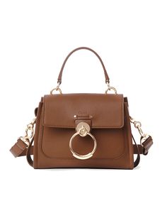 * Mini Tess Day Bag
 * Colour: Dark Nut
   
 * 100% Calfskin
   
 * Mini bag in grained & shiny calfskin
   
   
 * Main material: Calfskin
   
   
 * Secondary material: Calfskin
   
   
 * Main lining: Linen
   
   
 * Flap lining: Split calfskin
   
   
 * Carry: Hand, long shoulder & cross-body
   
   
 * Front flap with magnet closure
   
 * 1 front flat pocket
 * 1 inside zippered pocket
 * 1 back flat pocket
 * Mix of golden brass & silver finish
 * Style ID: CHC22SS143G3329X
 * Dust bag Chloe Tote, Chloe Bags, Chloe Handbags, Chloe Bag, Day Bag, See By Chloe, Sunglasses Sale, Black Mini, Soft Suede