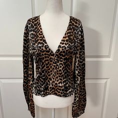 Ganni’s Silk Leopard-Print Blouse Is One You’ll Want To Wear On Repeat, Featuring A Plunge V-Neck And Billowy Blouson Sleeve. -Elasticated Cuffs -Decorative Button Placket In Front. -Back Zip Closure. -Unlined -Button-Embellished -92% Silk 8% Elastane A Fr 36 Is Equivalent To A Us4 Leopard Print V-neck Tops For Night Out, Elegant V-neck Leopard Print Top, Blouson Sleeve, Leopard Print Blouse, Satin Top, On Repeat, Print Blouse, Button Placket, Silk Satin