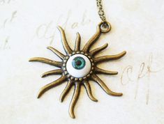 This Halloween necklace features a detailed green eyeball adhered onto antique bronze charm. The pendant is hanging from an antique bronze finished chain. - 18" approx chain length - The eyeball measures approx 12 mm in diameter. - The charm about 45mm x 45mm. Perfect for Halloween! ♥ See more Halloween jewelry here: https://www.etsy.com/shop/iceblues/items?ref=listing-shop-header-item-count&section_id=10461899 GIFTS Each item is individually wrapped in a branded jewelry gift box. We do not include price receipts in the package. We are happy to ship directly to the recipient. EXPEDITED SHIPPING At checkout, you have the option to choose faster shipping in the drop-down menu. Ship times do NOT include production times. However, if you select expedited shipping, we will try to get your order Eyeball Necklace, Creepy Jewelry, Jewelry Chunky, Jewelry Halloween, Halloween Necklace, Chunky Jewelry, Funky Jewelry, Halloween Jewelry, Halloween Gift