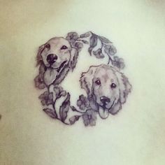 two dogs in a circle with leaves on the back of a woman's stomach