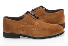 Soft, brogue-stitched suede and a formal derby lace design give these dress shoes a posh, classy style. Authentic Leather Suede Derby Suede Brogue Oxfords, Suede Brogue Oxfords For Derby, Suede Brogue Derby Lace-up Shoes, Suede Wingtip Oxfords For Derby, Wingtip Suede Dress Shoes For Derby, Suede Wingtip Dress Shoes For Derby, Elegant Suede Oxfords For Derby, Wingtip Dress Shoes With Suede Lining For Derby, Elegant Derby Oxfords With Suede Lining