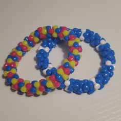 Beaded Bracelet Bundle. Handmade. One Of A Kind. Great For Edc Or Rave Concerts. Handmade Blue Beaded Plastic Bracelets, Adjustable Blue Plastic Stretch Bracelet, Playful Blue Beaded Bracelet, Rave Bracelets, Pandora Star, American Baby Doll, Bohemian Elephant, Kandi Inspo, Rose Gold Bangle Bracelet