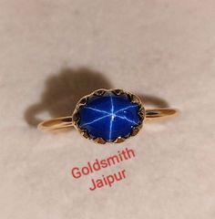 Band : Goldsmith jaipur  Material : 14k Yellow Gold Gemstone : blue  Lindy star sapphire Sapphire Stone size : 8x 6mm Stone Wight : 2.10Ct Stone Shape :Oval Stone Color : Blue Band Color : Yellow   style: Minimalist Ring Size : All Size Available All of our jewelry is handmade with great care by our team. Thank you for visiting our store. https://www.etsy.com/your/shops/Goldsmithjaipur/tools/listings/stats:true/1356025660 Celestial Yellow Gold Sapphire Ring, Vintage Star Sapphire Ring, Celestial Star-shaped Sapphire Ring, Lindy Star Ring Sapphire, Celestial Star-shaped Sapphire Gemstone Ring, Star-shaped Sapphire Gemstone Rings, Star Sapphire Cabochon Ring, Star Sapphire Gemstone, Blue Star Sapphire Ring