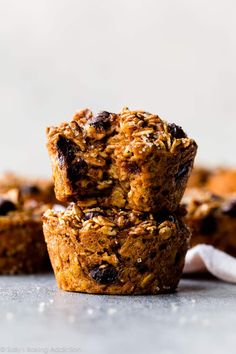 three oatmeal muffins stacked on top of each other with raisins