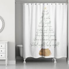 a white shower curtain with a christmas tree on it