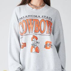 Vintage Ncaa Oklahoma State Cowboys Logo Sweatshirt, Oklahoma State Cowboys Shirt, Oklahoma State University, Unisex Shirt, Vintage Shirt Our Classic T-Shirt Serves As The Perfect Short-Sleeved Shirt For Your Unique, Funny, Or Personalized Designs. Brand: Gildan Heavy Weight Fabric Classic Unisex Makes This An Easy Fit Size Up If You Want Something Roomier Our Shirts Materials: 100% Cotton ** Note: - Double Check Your Address Before Ordering. - If You Want To Return The Goods, You Are The One To Retro Oversized Tops For Game Day, Oversized Retro Top For Game Day, Retro Campus Tops With Letter Print, Retro Letter Print Tops For Campus, Gray Crew Neck Top For Campus, School Spirit Graphic Print Top For Winter, Fall Campus Top With Logo Print, Graphic Print Winter College Tops, Winter College Tops With Graphic Print