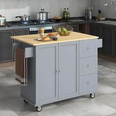 a kitchen island cart with food on it in the middle of a floored room