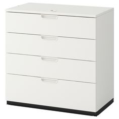 a white filing cabinet with three drawers