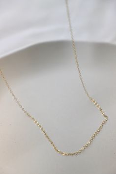 Our staple gold filled cable chain is the perfect piece for a simple yet classic look. Use for layering or choose from our charm collection to make your own unique piece. Available in multiple lengths for your desired fit. Details: - 14kt gold filled - simple cable chain - 16", 18", or 20" length SKU: CN1502 Materials+Care Bachelorette Party Dress, Champagne Dress, Rehearsal Dinner Dresses, Charm Collection, Rehearsal Dress, Maxi Dress Wedding, Fit Details, Reception Dress, Birthstone Charms