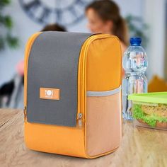 a lunch bag sitting on top of a wooden table