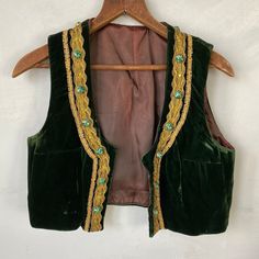 This beautiful green velvet vest was made for a woman due to the darts at the bust; it may have been a costume of some sort. This velvet is sumptuous and truly amazing, and the gold trim is a fun glittery accent! and fun! A phenomenal find! I have 8,000+ antique and vintage French and European textiles in my eBay and Etsy shops! Please visit us at textiletrunk.com and click SHOP for links ~ and please follow us on Instagram! @textiletrunk Lace Apron, French Workwear, Velvet Vest, 70s Inspired Fashion, Estilo Hippie, Deep Winter, Green Vest, Vintage Vest, Mode Inspo