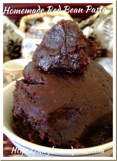 two pieces of brownie in a bowl on top of each other with the words homemade red bean paste