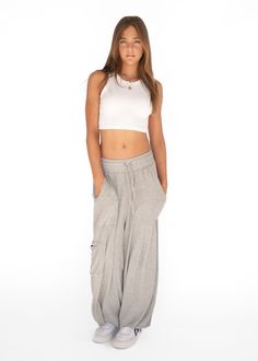 Introducing our Palazzo Pant, aka the pant of the summer. Made from an ultra soft cotton blend, it pairs perfectly with the Ribbed Racerback and Cropped Crew. You will never want to take them off and we don't blame you. Oversized fit Adjustable drawstring at the waist and ankle Made in Los Angeles Versatile Loose Fit Harem Pants For Loungewear, Versatile Harem Pants For Loungewear, Athleisure Harem Pants For Loungewear With Relaxed Fit, Summer Wide Leg Cargo Pants For Loungewear, Wide Leg Summer Cargo Pants For Loungewear, Everyday Wide Leg Athleisure Joggers, Cotton Wide Leg Pants With Side Pockets For Loungewear, Relaxed Harem Pants With Elastic Waistband For Loungewear, Baggy Wide Leg Harem Pants For Athleisure