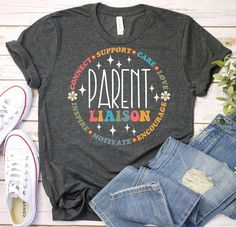 a t - shirt with the words parent and stars on it, next to some jeans