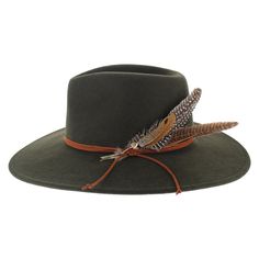 The American-made Stetson Coloma offers a touch of western style that combines city-chic design with outdoor-ready elements. Hand blocked of a soft wool felt for lasting comfort, this wide brim safari hat features a classic teardrop crown, surrounded by a leather hat band with feathers. The brim is trimmed with a welted edge and the interior has a vegan inner band and satin liner. The Coloma offers sophisticated style for men or women, and fits in anywhere, whether you are traversing the urban j Western Style Hats For Outdoor Fall, Country Style Felt Hat For Outdoor Fall Use, Wool Fedora For Rodeo In Fall, Wool Fedora For Fall Rodeo, Wool Fedora For Rodeo And Fall Season, Fall Rodeo Wool Felt Hat, Fall Fedora Hat Bands Made Of Felt, Fur Felt Hat For Rodeo In Fall, Brimmed Felt Hat For Fall Outdoor