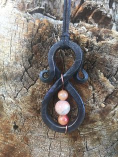 Decorative iron pendant with a Red Carnelian, and Moon stone in the center. It comes with a 29 inch waxed cotton cord necklace. It is coated with a traditional burnt on oil finish to help prevent rust. All of my products are hand made and most of the iron we use is recycled and repurposed. (Being hand made all sizes and measurements will vary) Thanks for looking feel free to contact me with any questions Viking Forge, Forged Jewelry, Iron Necklace, Hand Forged Jewelry, Nails Necklace, Cotton Cord Necklace, Beaded Jewelry Earrings, Iron Jewelry, Western Necklaces