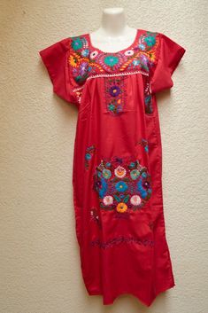 Magia Mexica Mexican Embroidered Dresses Women Short Dress multicolored handmade by Mexican artisans. Measurements (aprox): ↕  47 1/4 in ↔ 24 4/5 in Shoulder: 18 1/9 (may vary 1 or 2 inches) *The dress is shipped according to stock availability.  *There is no option of choosing. WARRANTY We use what is needed to make your item arrives 100% safe and intact to your address. SHIPPING & DELIVERY TIMEFRAME We ship your order within 1-2 days after purchase USA: *Free Shipping USA 15-20 business days Traditional Red Embroidered Dress With Geometric Patterns, Traditional Red Embroidered Dress With Geometric Design, Traditional Red Dress With Geometric Embroidery, Traditional Red Embroidered Dress For Fiesta, Bohemian Red Dress With Embroidered Border, Traditional Embroidered Dress For Cinco De Mayo Beach Event, Traditional Red Embroidered Dress For Beach, Traditional Red Embroidered Dress For The Beach, Red Bohemian Embroidered Dress For Fiesta