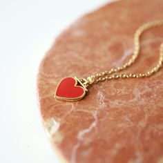 "Beautiful and lovely red heart charm necklace. Made of red enamel gold heart charm with skinny gold plated brass chain. Simple and warm. Great for gift, everyday or special occasion. Please choose chain color and length. Your item will ship in a gift box. Please feel free to contact me if you have any questions. ♥ Chain length available 14\" - 20\" ♥ Red heart 3/8\" ♥ Gold plated over brass/enamel ♥ See more Rudiana Accessories Rudiana.etsy.com" Dainty Red Charm Necklace For Valentine's Day, Red Dainty Charm Necklace With Heart Charm, Dainty Red Heart Charm Necklace, Dainty Red Heart Necklace With Heart Charm, Dainty Red Heart Necklace With Charm, Red Heart Charm Necklace For Her, Red Heart-shaped Charm Necklace, Enamel Heart Charm Necklace For Gifts, Red Charms Necklace For Valentine's Day