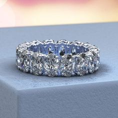 An exquisite reflection of your love, this fancy-shape diamond eternity band is certain to thrill for wedding or anniversary. Expertly crafted in sleek 14K White Gold, this remarkable design showcases sparkling 16 pieces 6x4 mm 6.5 Carat T.W. oval-cut CZ - each boosting a color rank of H and clarity of VS2 - that surround the endless band. Please remember that you can customize this ring in any way you would like in 3D. The exact number of diamonds and total carat weight will vary depending on t