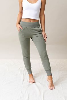 You'll love sliding into the oh-so-soft feel and effortlessly sleek style of these Stay In Joggers. These can take you from the gym to casual gatherings in your signature sporty-chic aesthetic. A relaxed fit with fitted elastic at the waist and ankles makes these athleisure jogger pants the perfect pick for tossing on as you head off to squeeze in a much-needed gym sesh. The side pockets give you a touch of functional flair, while the soft fabric blend makes these heather jogger pants a must-hav Affordable Sporty Joggers With Side Pockets, Urban Tees Casual Pants, Affordable High Waist Joggers For Spring, Cheap Trendy Spring Joggers, Casual Sports Joggers, Cheap High Waist Joggers For Spring, Cheap Fitted Joggers For Spring, Casual Moisture-wicking Joggers, Sporty Sweats For Fall