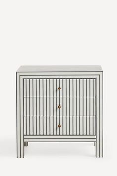 a white and grey cabinet with two drawers