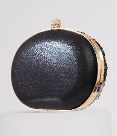 This dazzling 1920s style clutch handbag from Unique Vintage boasts a spooky design set in black beads and silver rhinestones. Complete with hinge opening, snap closure, and removable top handle and shoulder strap! Available while supplies last. Black Embellished Party Bag, Elegant Black Beaded Clutch, Black Rectangular Evening Bag With Rhinestones, Black Evening Bags With Sequins, Embellished Black Evening Bag For Night Out, Black Beaded Evening Bag For Wedding, Glamorous Beaded Evening Bag, Glamorous Beaded Evening Clutch, Black Rectangular Bag For Gala