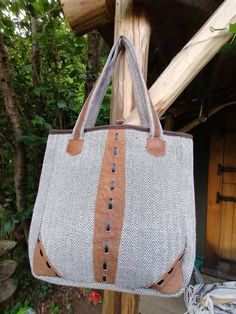 Another of the lovely shoulder bag designs, Ina grey tweed style with a unique leather detail through the center. Fully lined and with 2 zip compartments and an extra two small pockets inside. Zip fastening on top. Gray Shoulder Bag With Leather Handles, Gray Double Handle Shoulder Bag With Leather Handles, Gray Leather Handled Satchel Shoulder Bag, Gray Leather Handle Satchel Shoulder Bag, Gray Canvas Shoulder Bag With Leather Handles, Gray Tote Bag With Zipper Pocket, Gray Crossbody Bag With Leather Handles, Gray Satchel With Leather Handles, Gray Rectangular Shoulder Bag With Handles